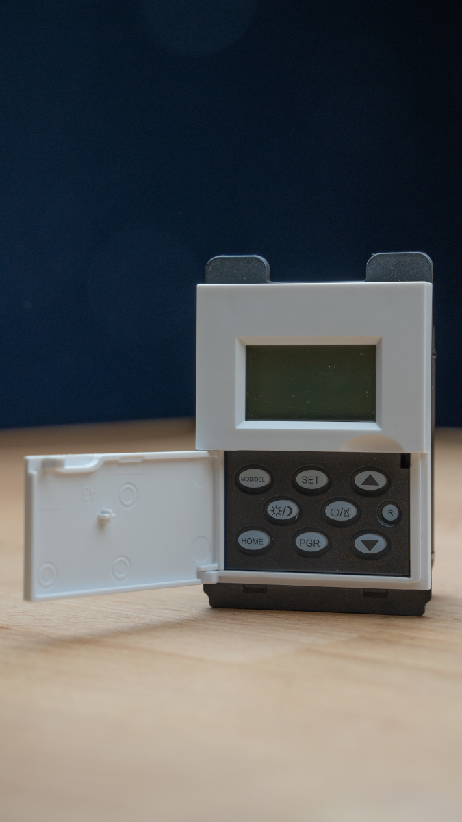 A freestanding Simple Astronomical Timer Switch with an open cover.